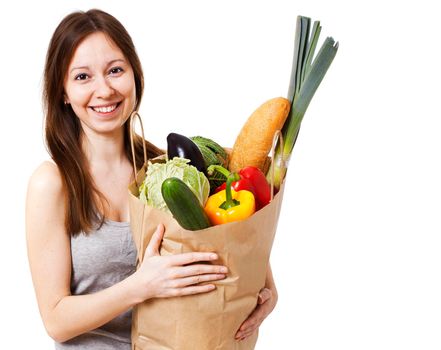 Happy Young Woman Holding Large Bag of Healthly Groceries - Stock Image/ Isolated on white