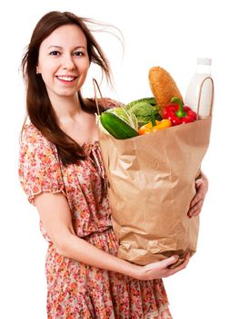 Happy Young Woman Holding Large Bag of Healthly Groceries - Stock Image. Isolated on white