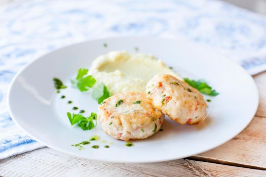 Fish or chicken cutlets with mashed potatoes. Restaurant.