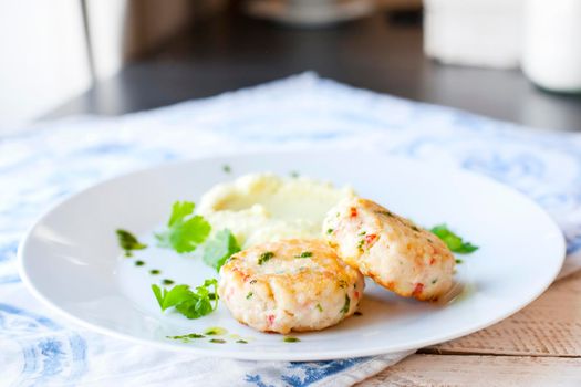 Fish or chicken cutlets with mashed potatoes. Restaurant.