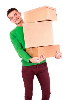 Guy holding large cardboard boxes. Vertical shot. Isolated on white.