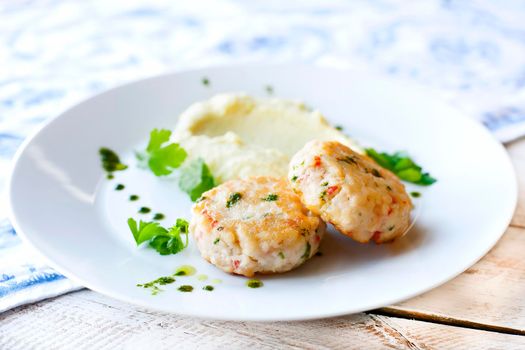 Fish or chicken cutlets with mashed potatoes. Restaurant.