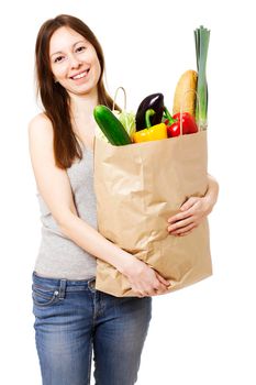 Happy Young Woman Holding Large Bag of Healthly Groceries - Stock Image. Isolated on white