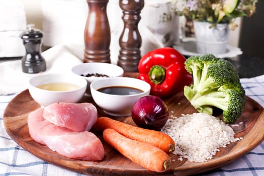 Raw ingredients for Teriyaki Chicken with Steam Rice and vegetables. Plated meal on restaurant - Stock image.