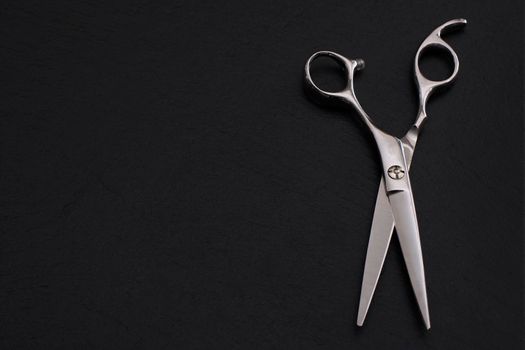 Hairdresser Accessories, Razor for cutting hair with copy space on a black background