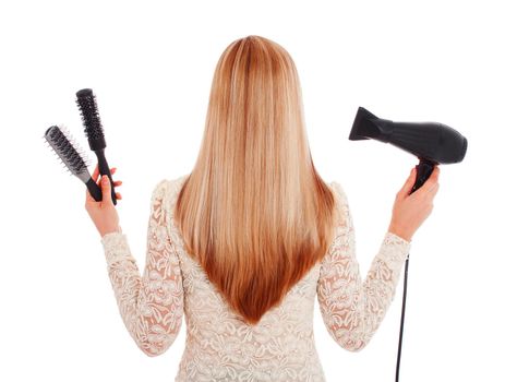 Blonde hair and hairdresser's tools, isolated on white