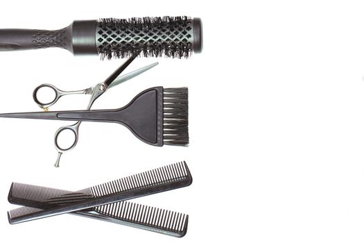 Hairdresser Accessories, Comb, Scissors and Razor for cutting hair on a white background