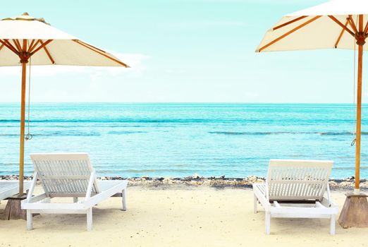 Beach Sun chairs on exotic tropical white sandy beach