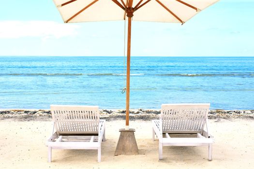 Beach Sun chairs on exotic tropical white sandy beach
