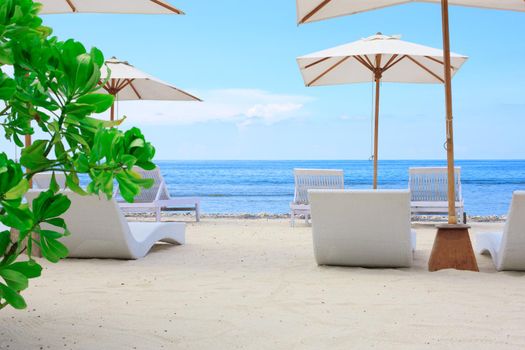 Beach Sun chairs on exotic tropical white sandy beach