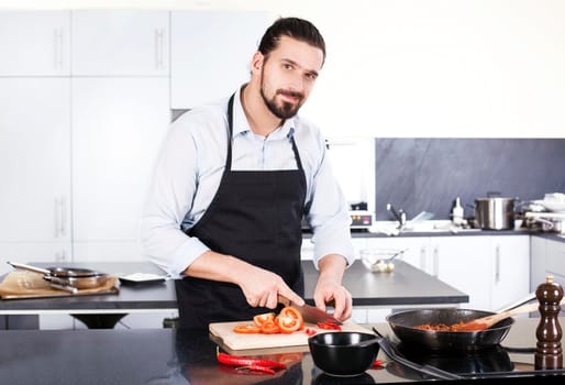 Chef preparing dishes in a frying pan. Cooking. Stock image