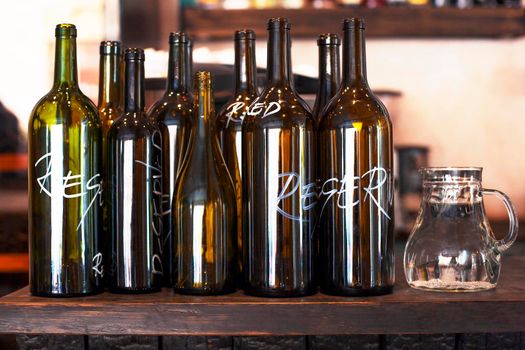 Empty decorative bottles for Red and White Wine in the bar or restaurant - Stock image