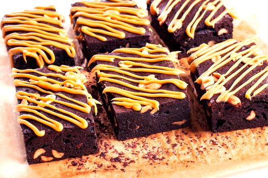 Dark Chocolate Cake with caramel. Pastry: Brownie - Stock image