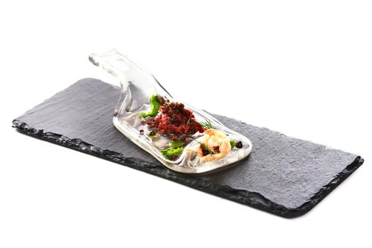 Molecular modern cuisine. Chips Pigskin with tartare or carpaccio of beef. Stock image. Isolated on white.