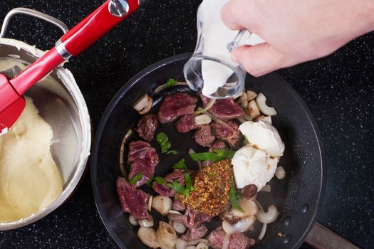 Assorted raw ingredients for Beef Stroganoff with mashed potatoes or celery. Top view - Stock image