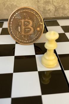 istanbul,Turkey.June 22,2022.cryptocurrency mining. Close-up bitcoin coin and chess game