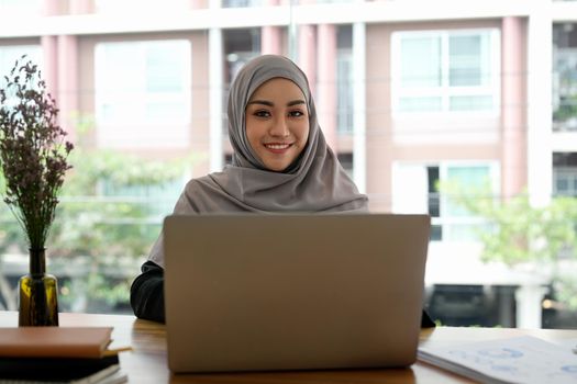 Portrait asian muslim woman manager working with laptop computer