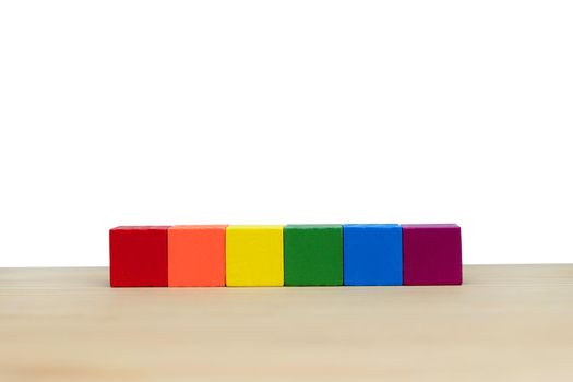 Empty multicolor wooden block on wooden with copy space on white background