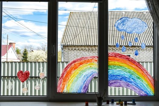 let's all be well. public flashmob children paint a rainbow on the windows waiting for the end of the quarantine pandemic coronavirus entertainment leisure home, copy space for text