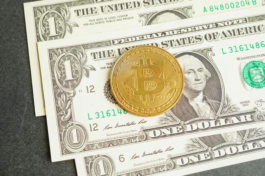 Golden bitcoin on US dollar banknotes money for business and commercial, Digital currency, Virtual cryptocurrency, blockchain technology.
