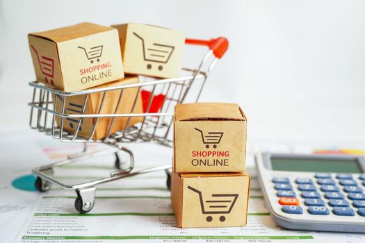 Online shopping, Shopping cart box on calculator, import export, finance commerce.