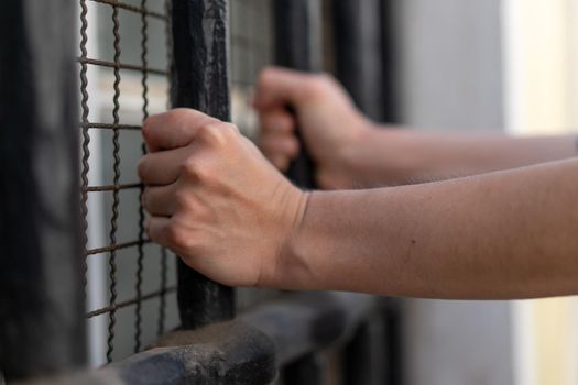 Slave girl in cage. Imprisonment, Female prisoner, Women violence and abused concept, human trafficking Concept, international women's day.