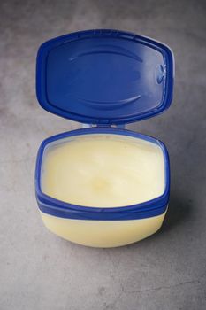 Close up of used petroleum jelly in a container ,