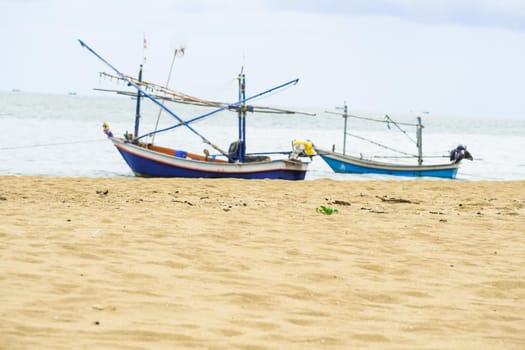 Fishing boat on beautiful beach seaside landscape Thailand. Holiday summer concept idea.