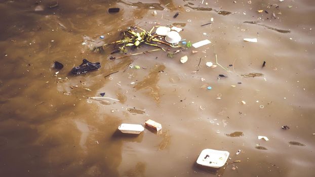 Water pollution caused by dumping plastic waste. Resulting in a bad environment social