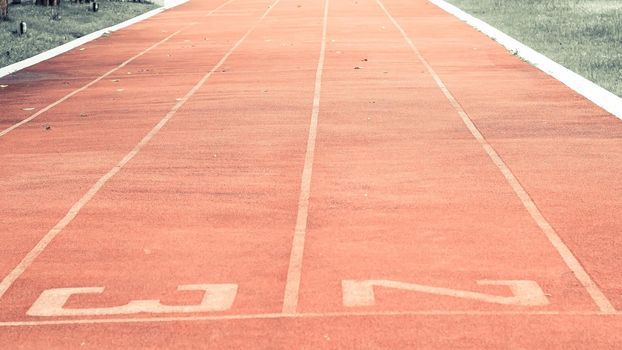 Starting line on running track .Red running track Synthetic rubber on the athletic stadium