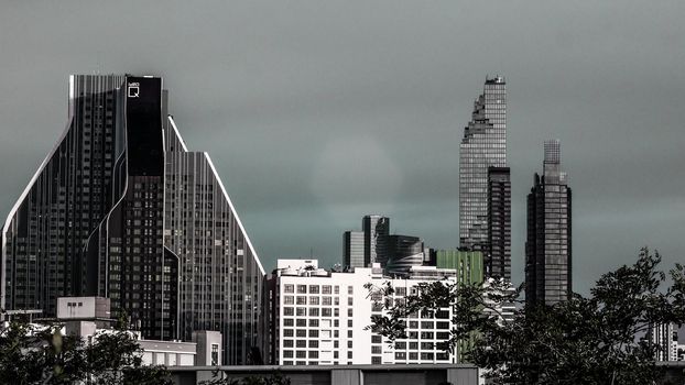 Aerial view of Bangkok modern office high rise buildings, condominium in Bangkok city downtown with sunset sky, Bangkok, Thailand