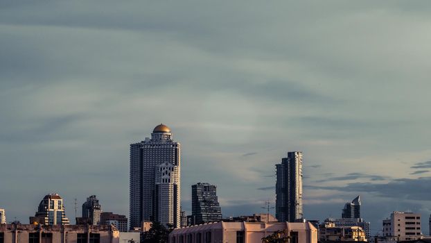 Aerial view of Bangkok modern office highrise buildings, condominium in Bangkok city downtown with sunset sky , Bangkok , Thailand