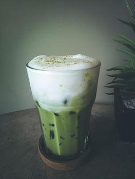 Iced Green Tea Coffee Late or Matcha & Espresso Fusion on loft concrete