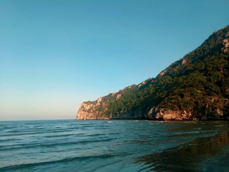 Sea and mountains landscape with blue gradient color. Summer holiday idea nature background