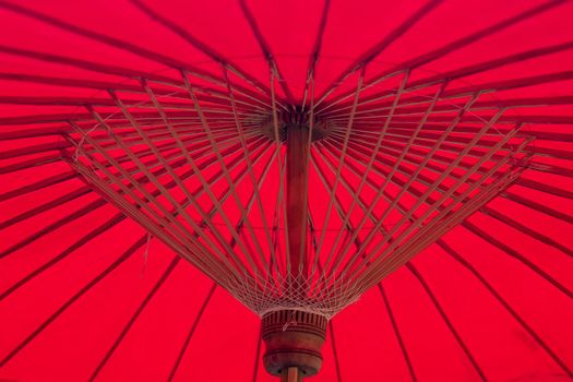 Under red umbrella. Bamboo structure .Asian background idea