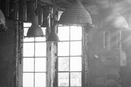 Old vintage Industrial interior with bright light coming through windows. Beautiful sunlight