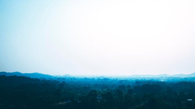 Beautiful sunrise over the mountain range. Group of tree scenario. tropical forest nature  at the south of Thailand