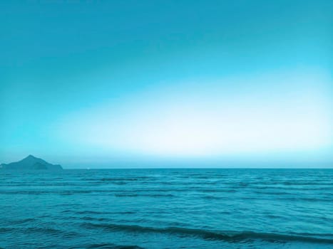 Sea and mountains landscape with blue gradient color. Summer holiday idea nature background