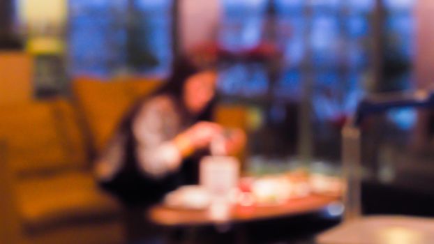 abstract blurred group of asian friends meeting in the restaurant background.Party have fun time concept idea