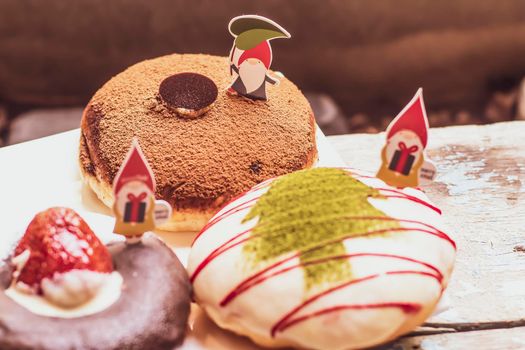 Christmas homemade desserts on table in decorated New Year background