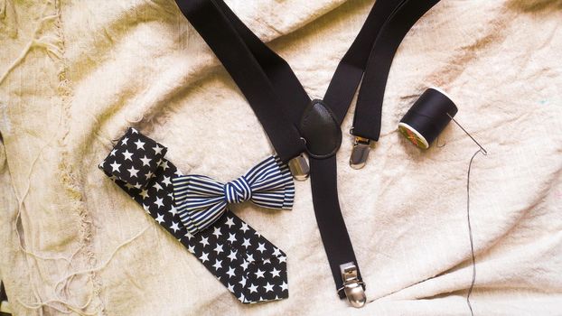 bow tie neck tie  and braces for baby boy background