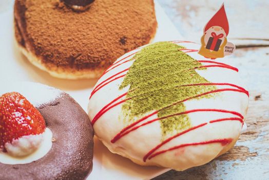 Christmas homemade desserts on table in decorated New Year background