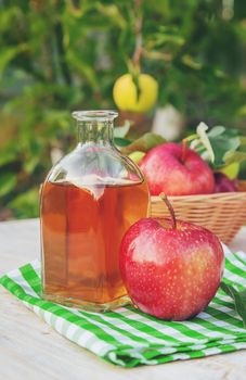 Apple cider vinegar in a bottle. Selective focus. nature.