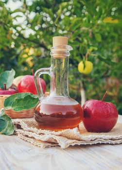 Apple cider vinegar in a bottle. Selective focus. nature.