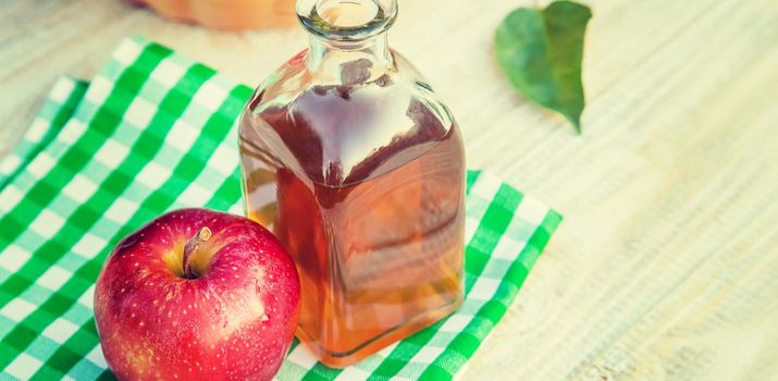 Apple cider vinegar in a bottle. Selective focus. nature.