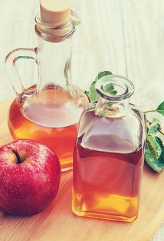 Apple cider vinegar in a bottle. Selective focus. nature.