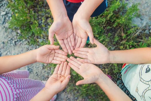 children hold hands together. Selective focus. nature.