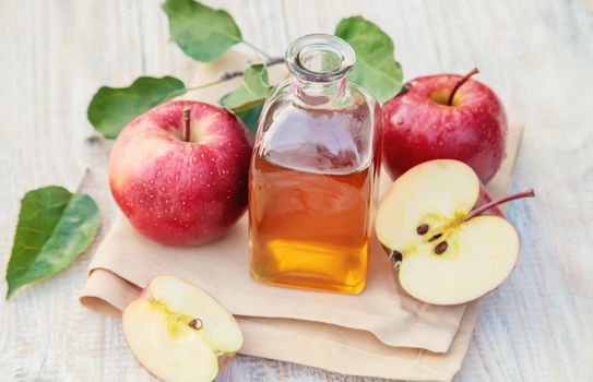 Apple cider vinegar in a bottle. Selective focus. nature.