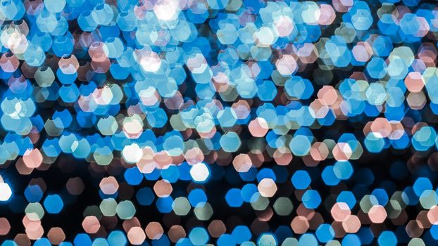 Abstract colorful bokeh light on dark background. Christmas and New Year theme