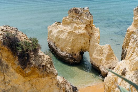 The rocky cliffs of Vale do Olival beach in Armacao de Pera, Portugal. High quality 4k footage